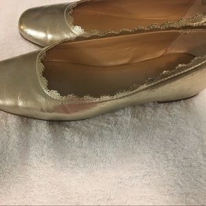 Leather metallic gold flats with scalloped edges. Crown & Ivy brand